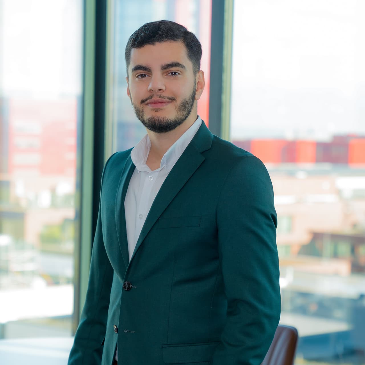 Shayan Ramezani, web designer, in his Luxembourg office